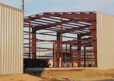 Red Iron Structural Steel Frame Partially Paneled