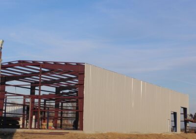 Red Iron Structural Steel Frame Partially Paneled Full View