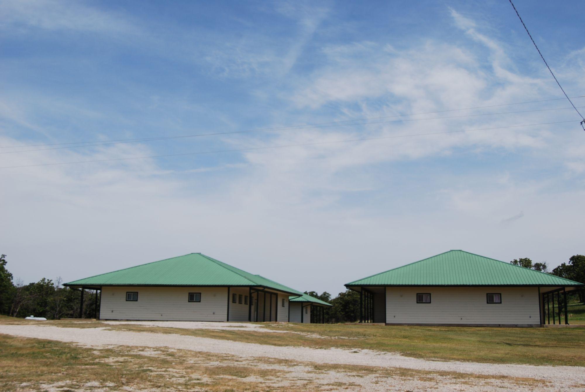 Two Metal Commercial Buildings White-Green