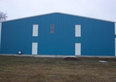 Two Story Metal Commercial Building Blue-White End View
