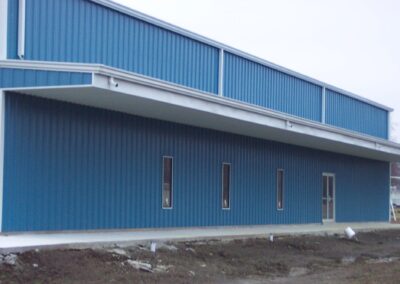 Two Story Metal Commercial Building Blue-White Side View
