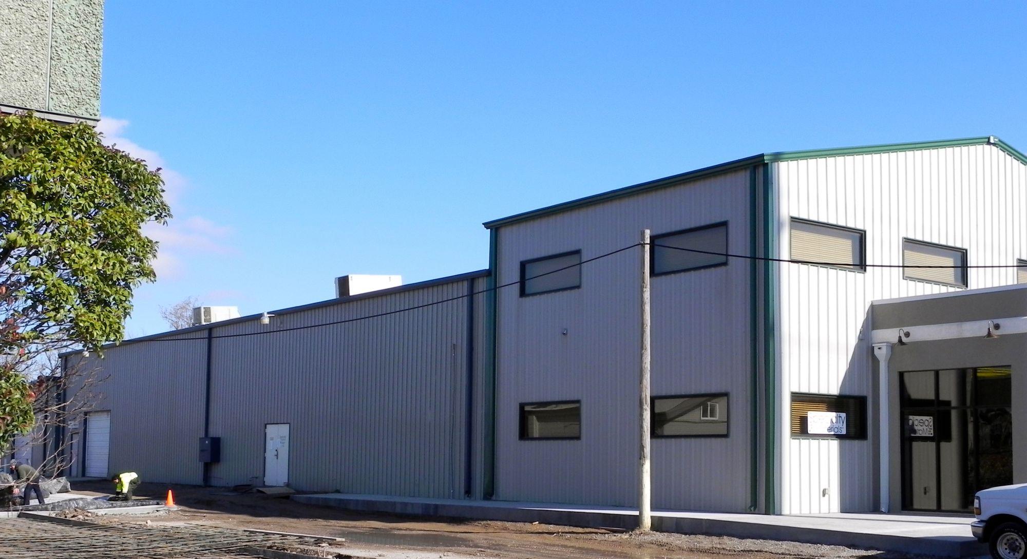 Two-Story Metal Commercial Steel Buildings Tan-Green Corner View